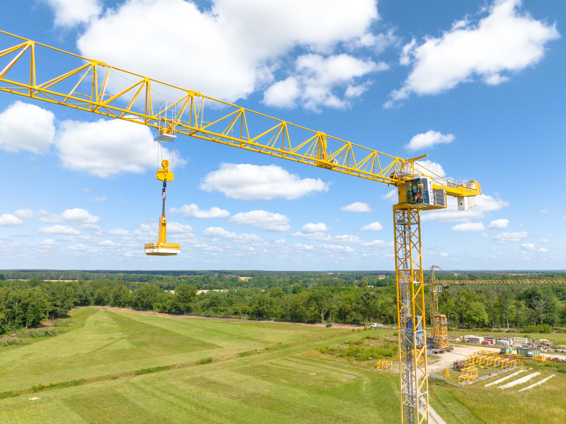 Photo of a Tower Crane Under Gray Sky · Free Stock Photo